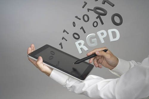 RGPD, Spanish, French and Italian version version of GDPR: Reglamento General de Proteccion de datos. General Data Protection Regulation. Young man working with information.